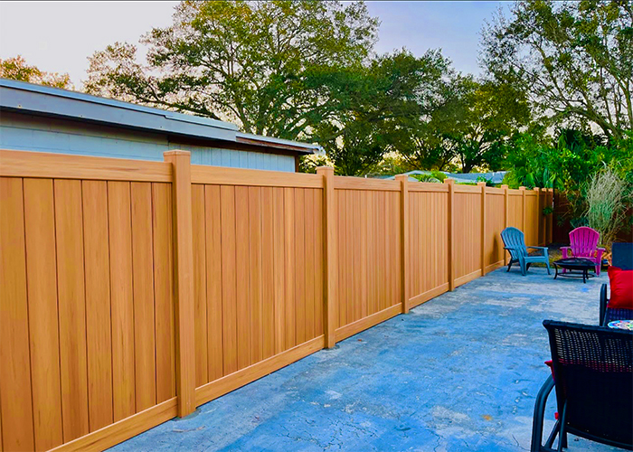 Vinyl Privacy Fence · Wood-Tone Finish
